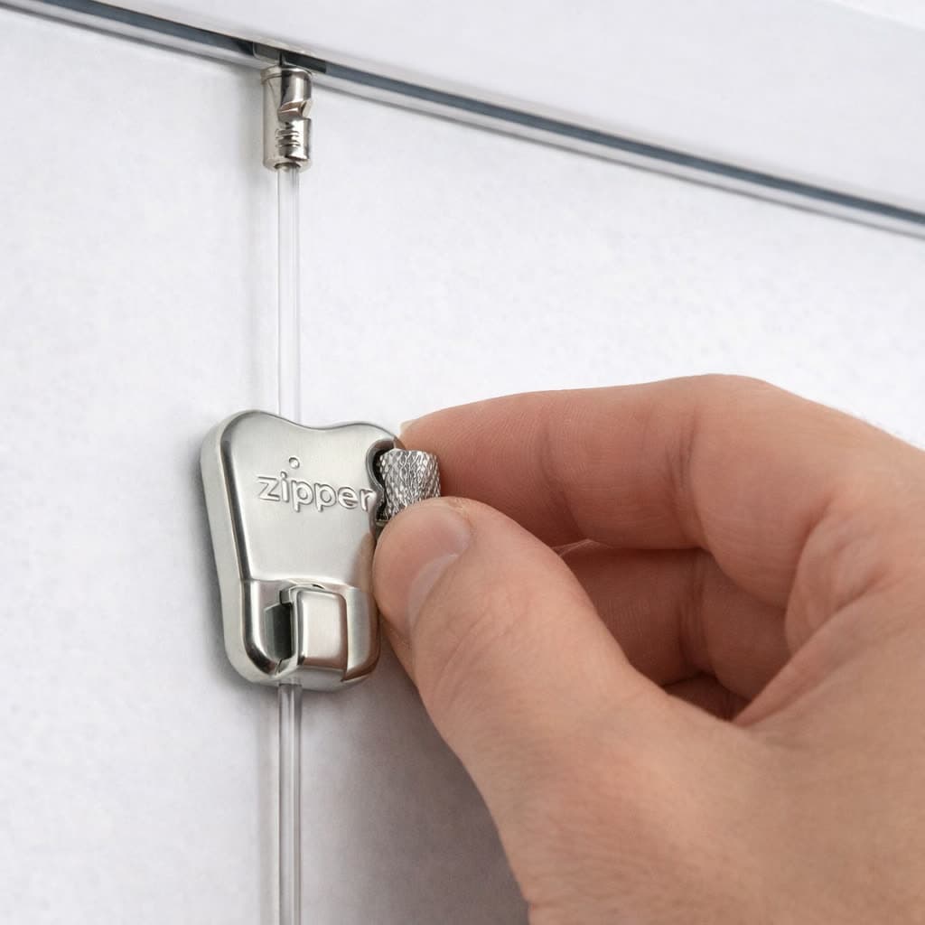 A Perlon cord hanging from the rail with a Zipper hook being set on it